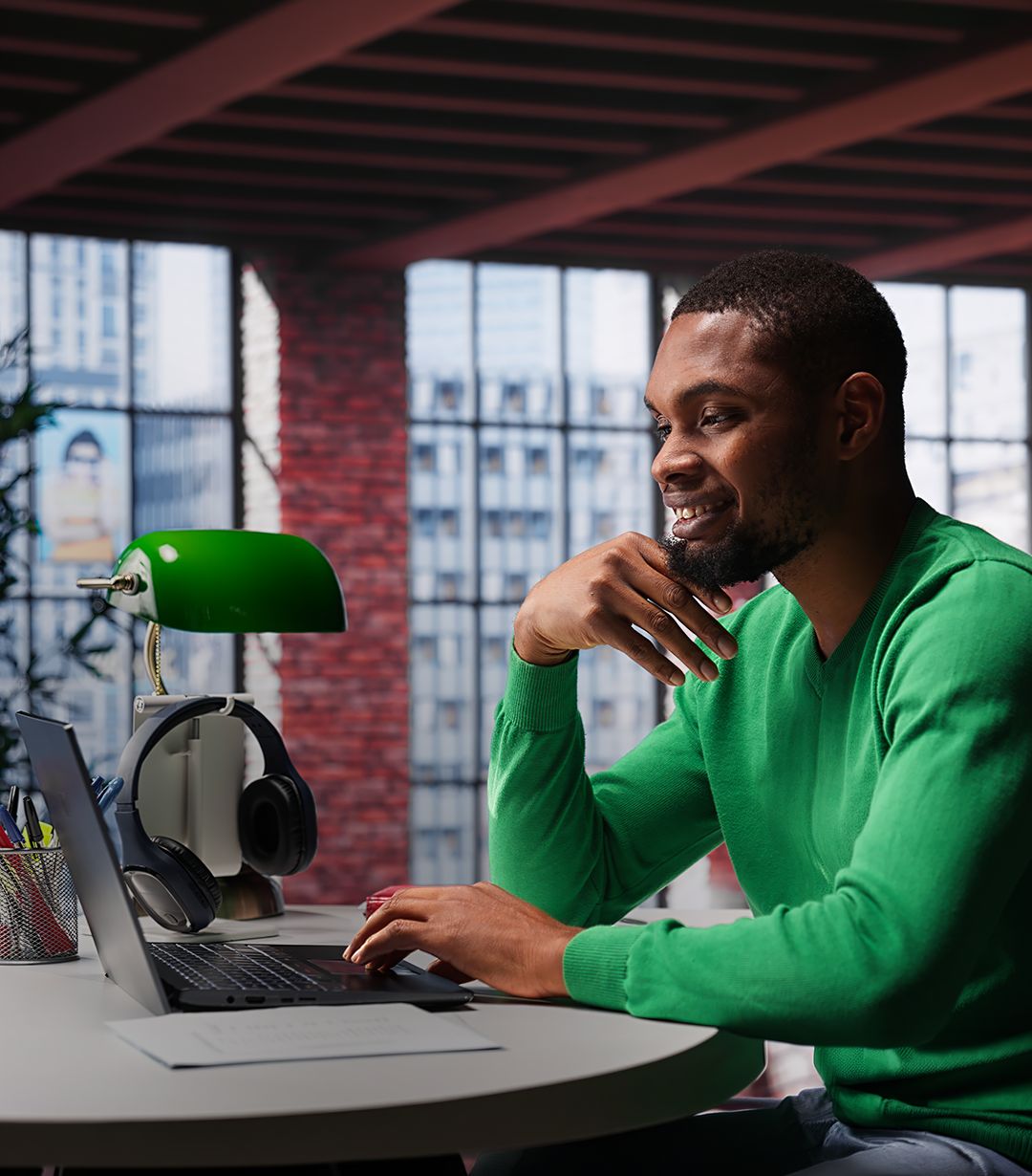 IT professional reviewing patch status on a laptop